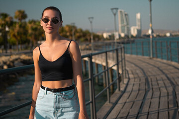 Young Woman on a Bridge with a Sea View