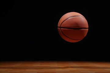 Obraz premium Basketball suspended mid-air against black backdrop, game, background