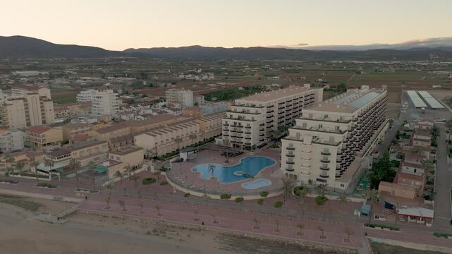 Drone aerial view of a beach in a coudy day in Peniscola