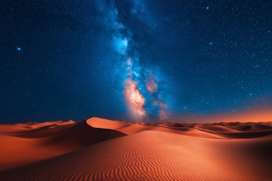 Photo r&eacute;aliste professionnelle d&rsquo;un paysage d&eacute;sertique &eacute;poustouflant avec des dunes de sable ondul&eacute;es sous un ciel nocturne &eacute;toil&eacute;, avec la Voie lact&eacute;e clairement visible