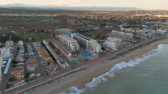 Drone aerial view of a beach in a coudy day in Peniscola