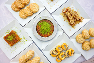 Turkish Dessert Sobiyet, havuc dilimi, midye baklava, mussels baklava and classic baklava with Pistachio . Cikolatali cevizli, fistikli soguk Baklava, top view.