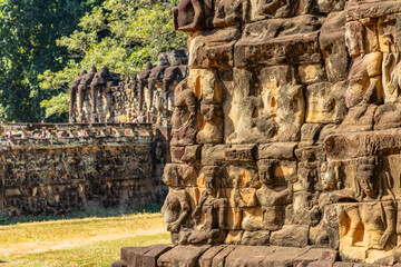 Fototapeta premium Terrace of the Leper king with terrace of elephants in the background, ceremonial wall of hindu sculptures, Angkor Thom Archaeological Park, Siem Reap, Cambodia