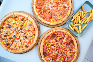 Traditional Turkish cuisine. Pizza, pita, pidesi, sucuk, hummus, kebab. Many dishes on the table. Serving dishes in restaurant. Margherita,  mix, formaggi, veggie karisik pizza. Top view, flat lay