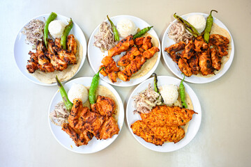 Delicious meat kebab with fresh vegetable salad served with variety of Turkish dishes and appetizers. Top view of assorted Turkish food and meze, tasty and healthy Mediterranean cuisine.