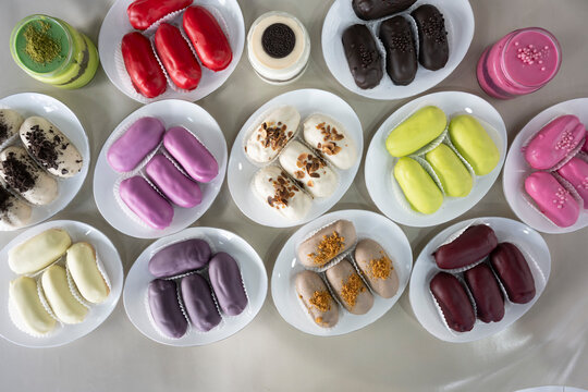 Ekler Pasta Turkish delicious ekler pasta with plate. Klasik, cikolatali, muzlu, frambuazli, karamelli, cilekli, oreolu ekler.