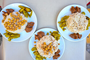 Delicious meat kebab with fresh vegetable salad served with variety of Turkish dishes and appetizers. Top view of assorted Turkish food and meze, tasty and healthy Mediterranean cuisine.