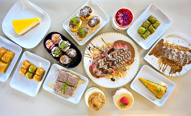 Delicious meat kebab with fresh vegetable salad served with variety of Turkish dishes and appetizers. Top view of assorted Turkish food and meze, tasty and healthy Mediterranean cuisine.