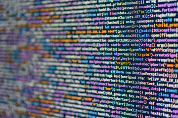 Close-up image of a Python code on a computer screen, showcasing its dense and colorful structure