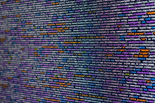 High-resolution image of JavaScript code, color-coded and blurred background, possibly from a professional software development or computer science setting