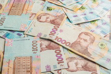 Ukraine money 1000 hryvnia background. Ukrainian finance, salary, pension, donations, taxes. Background of the 1000 hryvnia