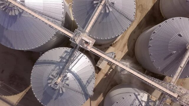 High angle straight down view of grain elevators in Madison, South Dakota. This is a drone shot.