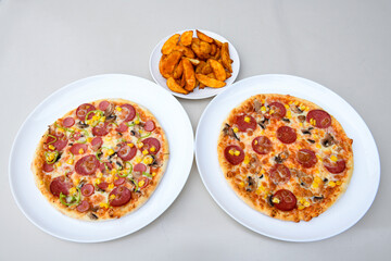 Traditional Turkish cuisine. Pizza, pita, pidesi, sucuk, hummus, kebab. Many dishes on the table. Serving dishes in restaurant. Margherita,  mix, formaggi, veggie karisik pizza. Top view, flat lay