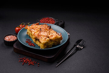 Lasagna or pasta layered with meat, cheese, salt, spices and herbs