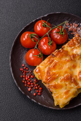 Lasagna or pasta layered with meat, cheese, salt, spices and herbs