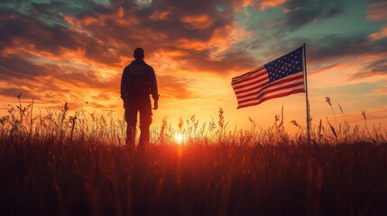 Silhouette of a man standing in a field at sunset, with an American flag waving in the background. A powerful image of patriotism and remembrance.