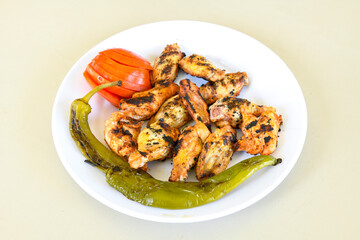 Chicken wings barbeque in a dish with BBQ grill sauce . Izgara tavuk kelebek sis kanat. Tavuk sis, gogus.