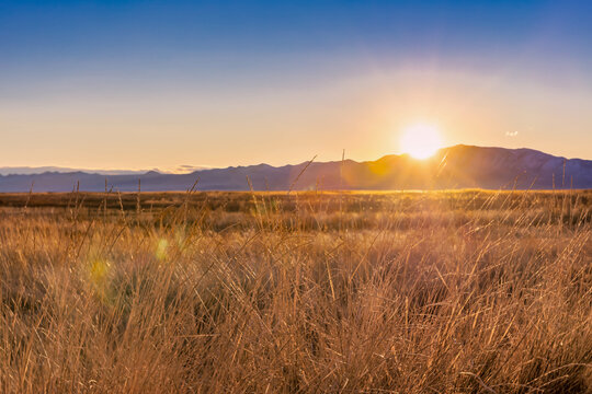 Sunset Over Mountain in a Marsh Land