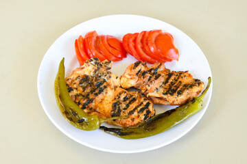 Chicken wings barbeque in a dish with BBQ grill sauce . Izgara tavuk kelebek sis kanat. Tavuk sis, gogus.
