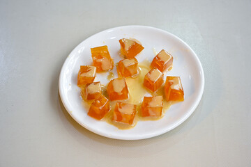 Traditional Turkish pumpkin dessert (kabak tatlisi) photo in close view .