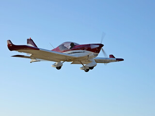 Yaslo, Poland - 9 3 2019: A light sport turboprop aircraft flies across the sky among the rainy clouds. Landing in difficult weather conditions. Meteorology and weather forecast for aviation