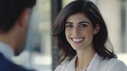 Happy young business woman bank manager handshaking client at meeting. Smiling female hr hiring recruit at job interview, insurance agent, lawyer making contract deal at work with business handshake.