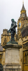 Obraz premium Oliver Cromwell statue in front of the Palace of Westminster, the meeting place of the Parliament of the United Kingdom located in London