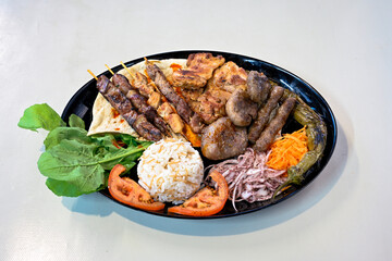 Famous Urfa meat liver, ciger wrapped by lavash with roasted chili pepper, onion and sauce in...