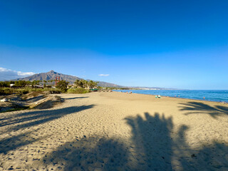 Playa Río Verde beach near Puerto Banús and a view towards the Pico de la Concha mountain, landmark of Marbella, Malaga, Costa del Sol, Spain