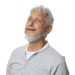 Sad senior man crying on white background