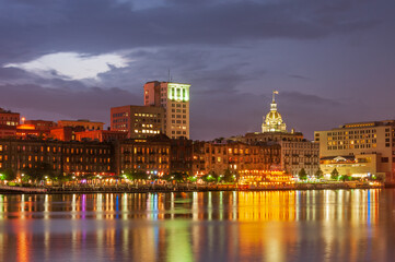 Panorama of illuminated waterfront Historic District at dusk, Savannah downtown, USA