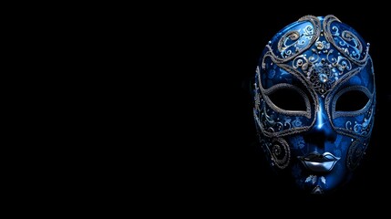 A black background featuring copy space enhanced by a blue carnival Venetian mask adorned with silver decorations