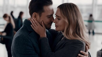 Couple Shares an Emotional Farewell at the Airport During the Winter Season