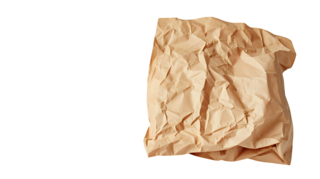 A crumpled brown paper bag with visible texture, isolated on a bright white surface 