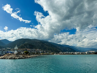 Scenic coastal view featuring a lighthouse under a dynamic sky in Cyprus