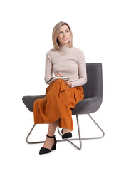 Professional psychologist with notebook sitting on chair against white background
