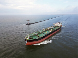 A large oil tanker leaving the port of Rotterdam