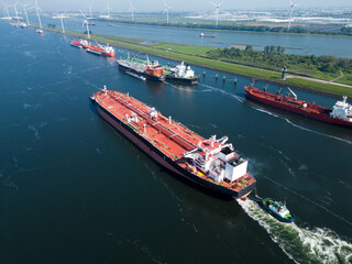 A large oil tanker and tugs in the port of Rotterdam