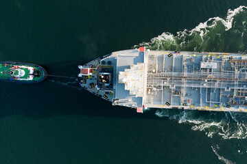 A large oil tanker and tugs in the port of Rotterdam