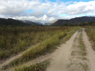 A beautiful landscape of large forests and mountains in the background at the top of Serra do Cipo