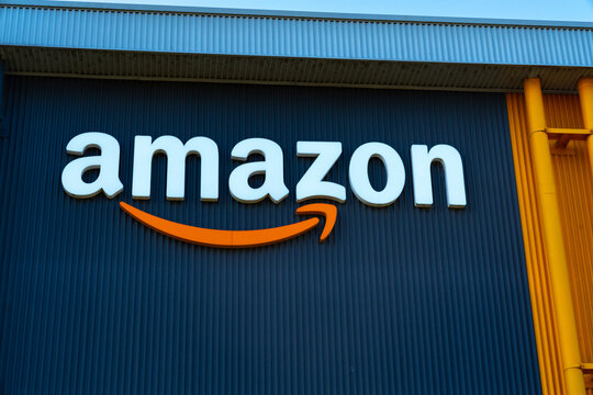 Close up view of an Amazon sign and corporate Amazon logo on an Amazon warehouse in Moorebank, Sydney NSW Australia 