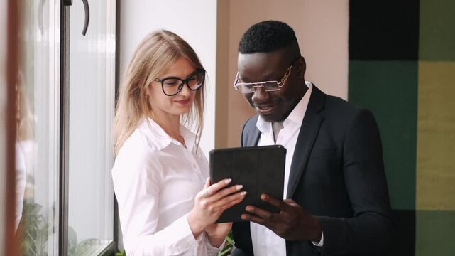 a group is working togeather on a project debating and sharing ideas