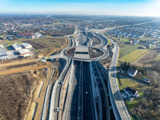 Krakow, Poland.  Zielonki highway junction with traffic circle on S52 highway, part of motorway ring road around Cracow, opened for traffic on December 23, 2024. Viaducts, tunnels, ramps. Aerial view