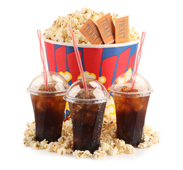 Tasty popcorn, soda drinks and movie tickets isolated on white