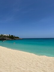 White Sands Beach: A serene view of a pristine white sands beach, with turquoise waters gently lapping the shore. Perfect for showcasing tropical landscapes, relaxation, and coastal beauty.