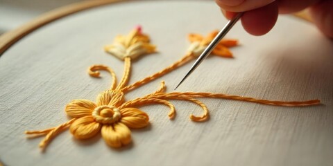 Hand embroidery technique demonstrating detailed floral patterns on fabric with needlework skills