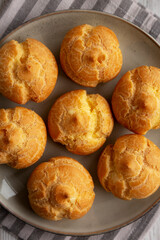Homemade French Mini Cream Puffs on a Plate, top view.