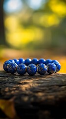 Lapis lazuli beaded bracelet resting on rustic wood with blurred warm background : Generative AI