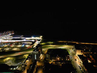 Aerial View of Illuminated Brighton Beach and Ocean City and British Tourist Attraction of East Sussex, England Great Britain During Night. Drone's Camera Footage Captured on December 3rd, 2024