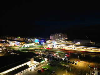 Obraz premium Aerial View of Illuminated Brighton Beach and Ocean City and British Tourist Attraction of East Sussex, England Great Britain During Night. Drone's Camera Footage Captured on December 3rd, 2024